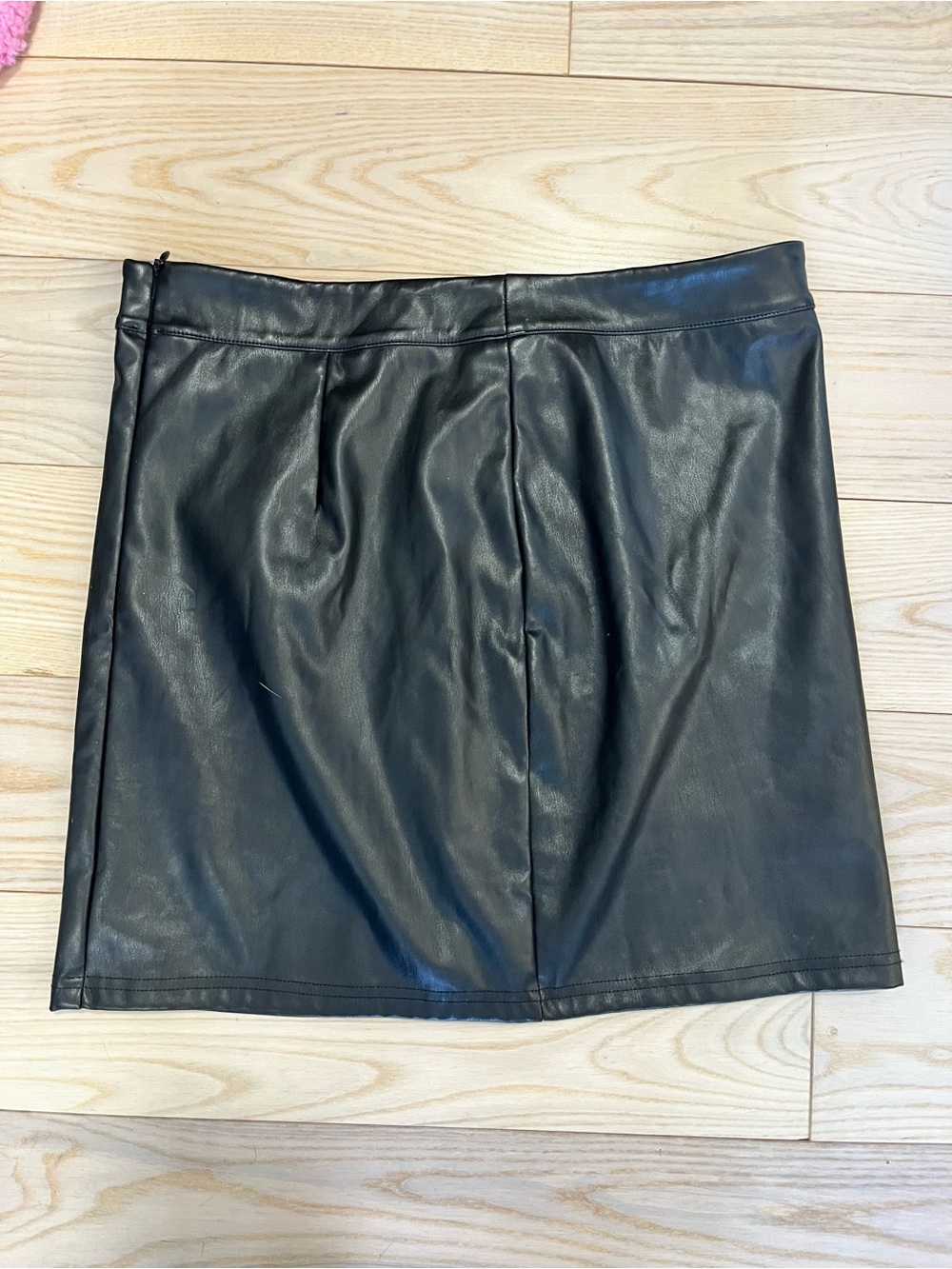 Black faux leather mini skirt with zipper closure